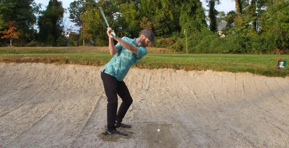 Golfer mid-swing illustrating ClubWatch and swing dynamics